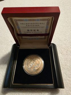 Commemorative Pand coin certified.