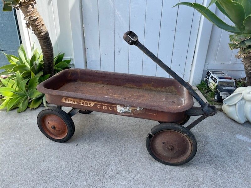 Vintage Firestone wagon radio flyer style. Rusty patina condition. 1950s era