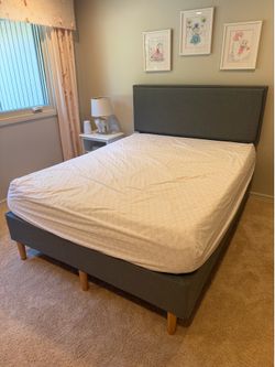 Purple upholstered platform queen bed with headboard