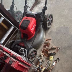 Milwuakee Mower With Battery And Charger And Weedeater 