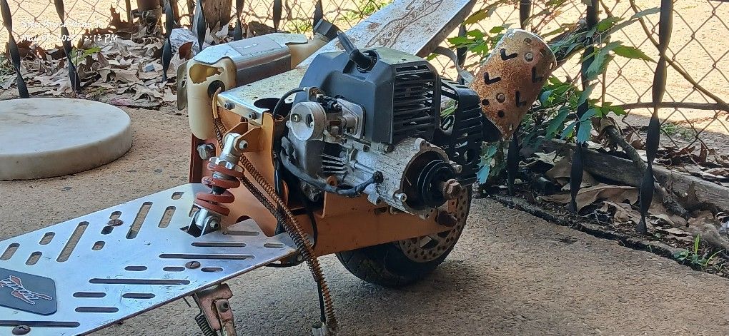 Gas And Electric Scooter. Formula Motorcycle Or Scooter.