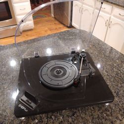 ION iLP Digital Conversion Turntable for iPhone, iPad and iPod touch. Used a few times only. Great shape. Tested and works perfectly. The lid has to t