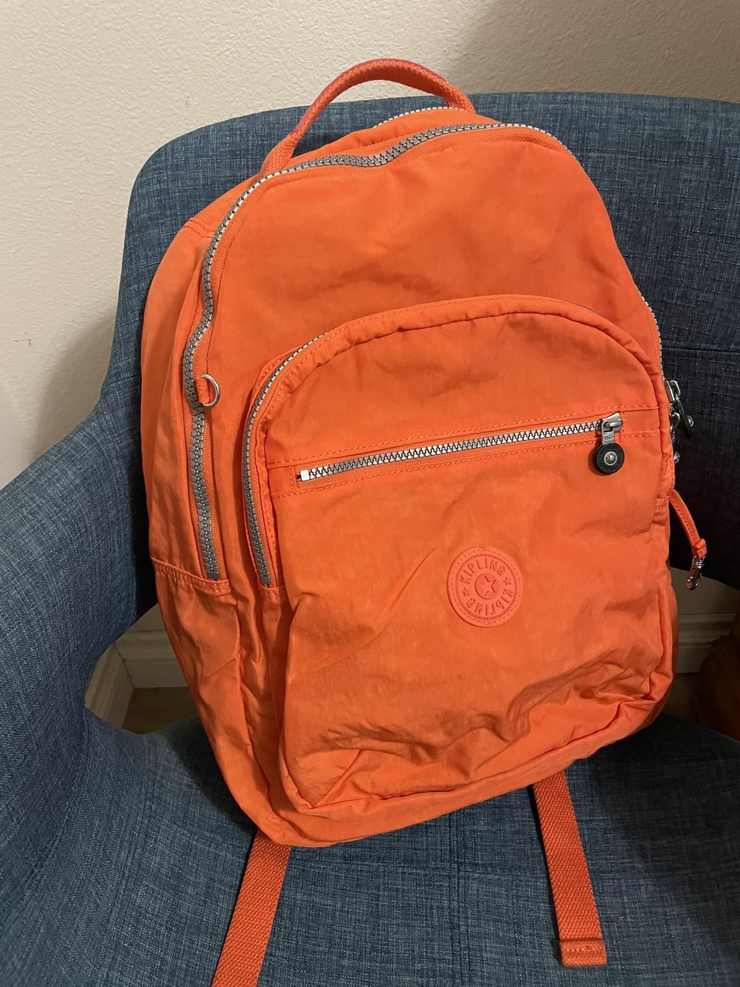 Kipling orange backpack top