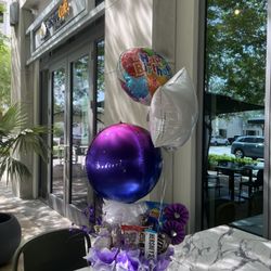 Birthday Gift Box with Balloons and Snacks