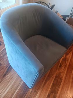 Blue accent chair swivels