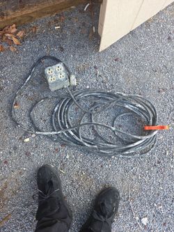 Heavy duty extension cord with 4 plug in box