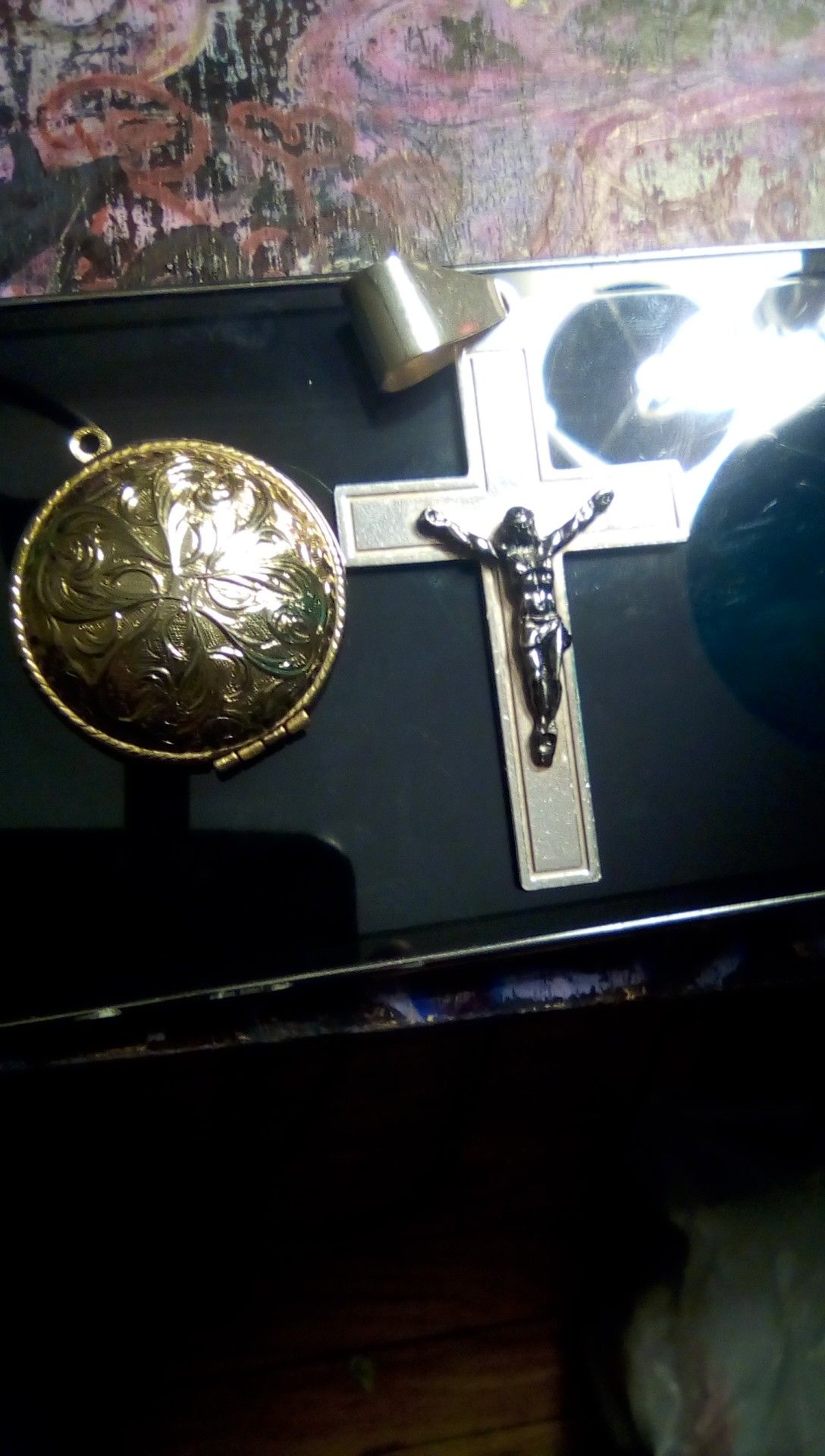 Cross medallion with picket looking watch thing or picture medallion