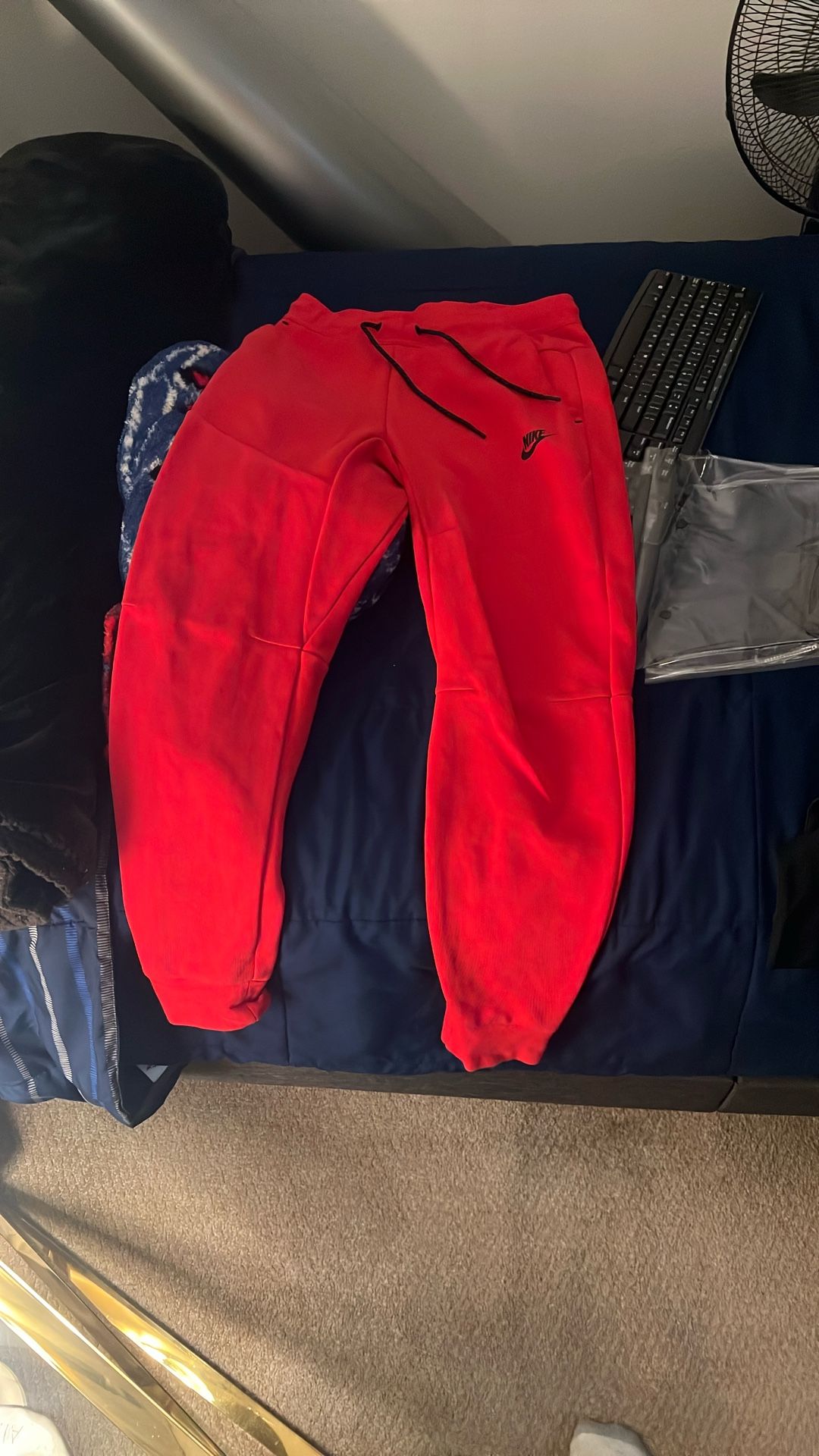 red nike tech sweat pants