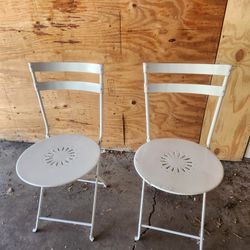 Two folding metal chairs in good condition