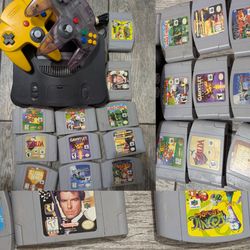 Vintage Nintendo 64 bundle with 12 video games , super Mario Mario kart, Zelda banjo kazooie GoldenEye and much more