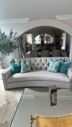 Gray Tufted Curved Sofa with Nailhead Trim