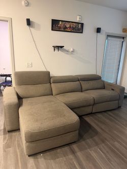 Sectional reclining sofa with ottoman