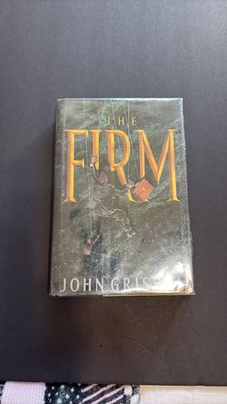 The Firm by John Grisham . Hard cover , Used / Good condition .