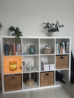 White IKEA Kallax 12-Cube Shelf with 3 Woven Baskets