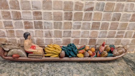 unique custom hand crafted Amazon man on canoe with goods 13 in x2"