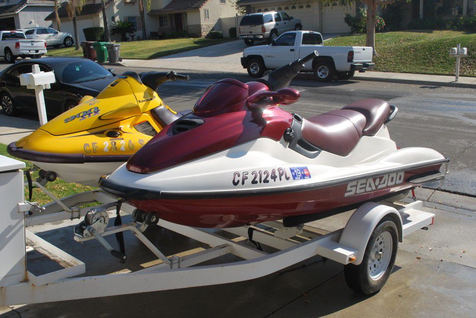 2 jet skis and a trailer