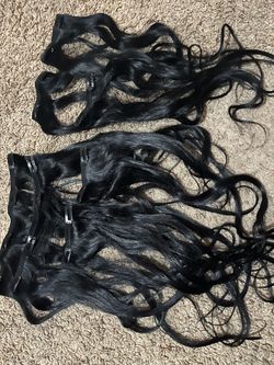 Clip on black hair extensions