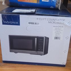 Brand new Insignia .9 Cu Ft Microwave