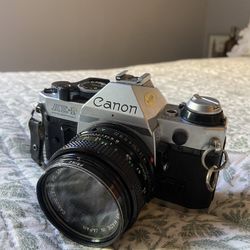 Canon AE1 Film Camera And Flash Attachment