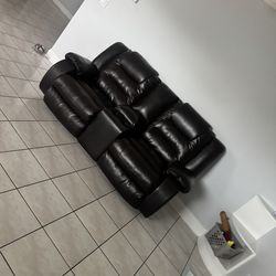 Dark brown leather reclining, couch, and loveseat