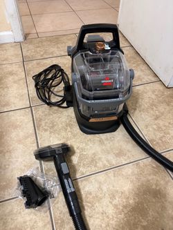 BiSSEll ROTATE OVER TANK TO UNLOCK LID A-