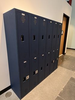 Commercial 12-door metal employee locker unit in navy blue