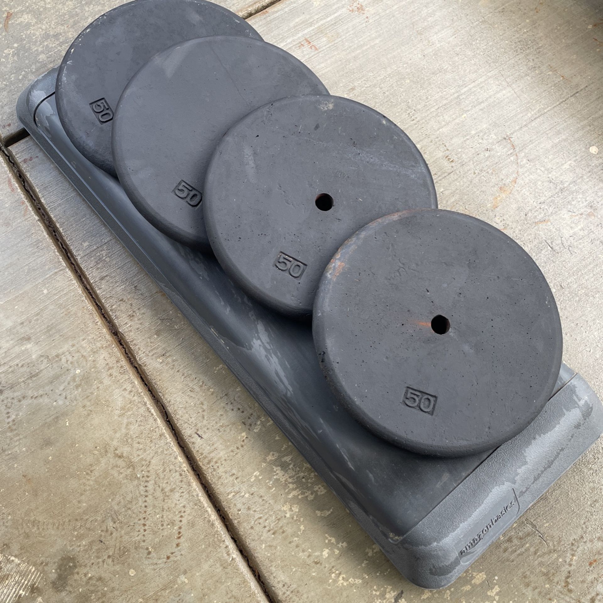 Four 50 Lbs Weight Plates: 200 Lbs Total