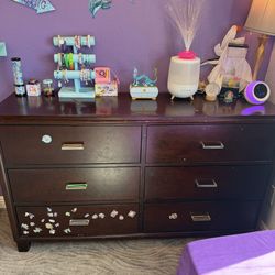 Dark wooden/cherry colored dresser