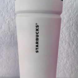 With Venti Starbucks cup with no spill lid
