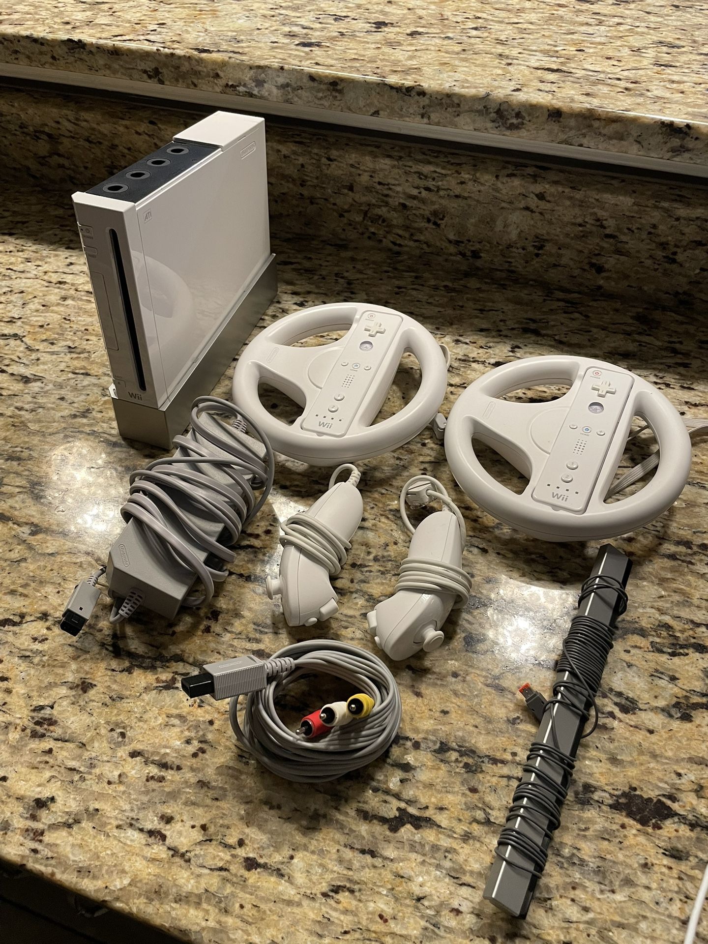 Nintendo Wii Bundle โ 2 Remotes, Nunchucks, Steering Wheels โ Works Great!