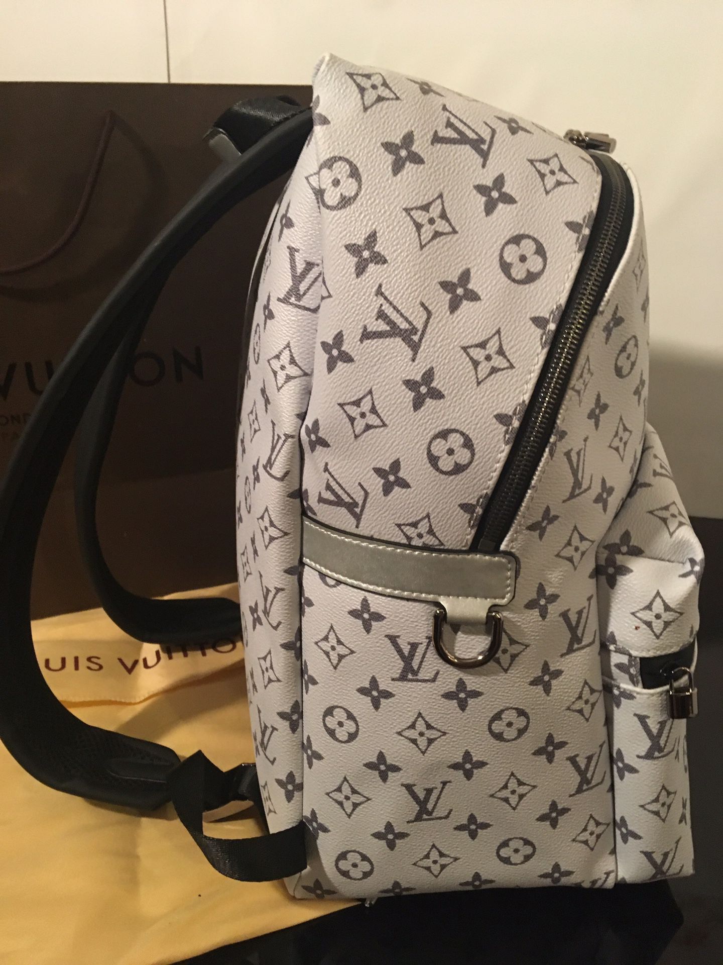 Louis Vuitton Apollo Backpack reflect