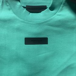 ESSENTIALS FOG TEAL TEE XS-XL