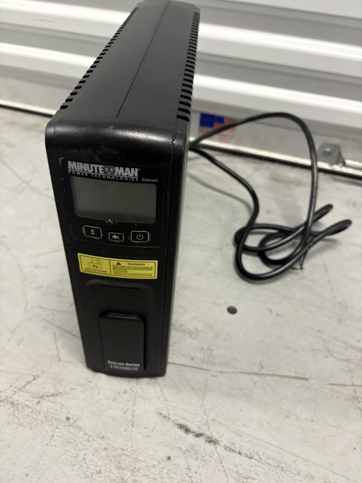 Minuteman ETR1500LCD 900W Battery Backup Power Supply -used   Appears to be working  Included a pic just in case  Battery included though not complete