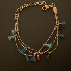 7” Goldtone Multi Strand Bracelet With Dangling Fabric Charms