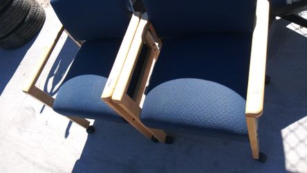 2 blue rolling chairs