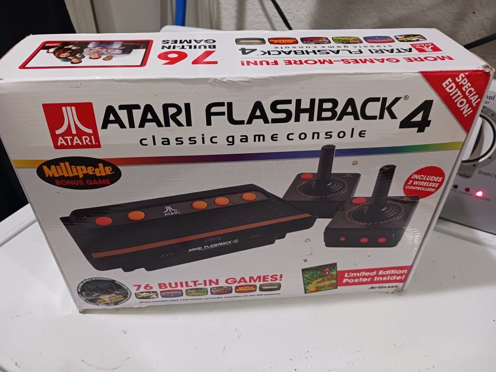ATARI FLASHBACK 4 Classic game controller. Good Condition. 76 built in games. includes 2 wireless controllers.