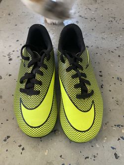 Several Kids Soccer Cleats Socks Shin Guards