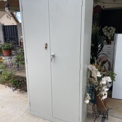 Tall Metal Shelf Two Doors And Keys