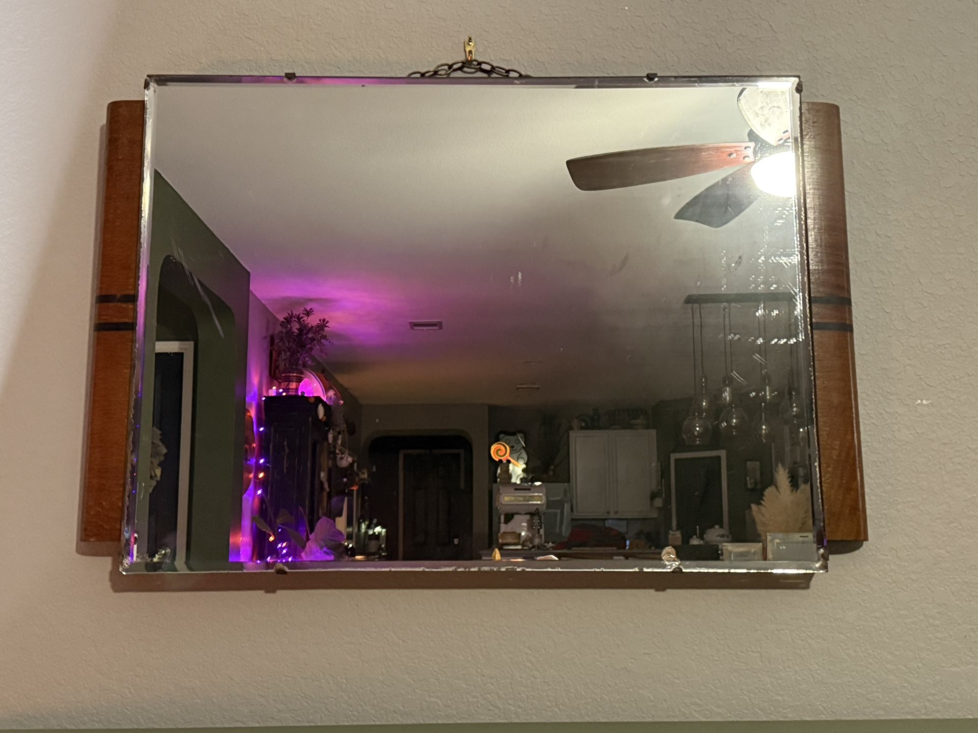 Vintage Art deco mirror with original finish and patina with solid brass chain.