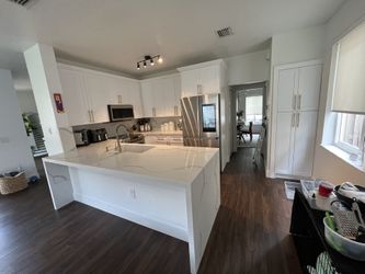 Kichen Cabinets/ Countertop/ Laminate Flooring/closets. 