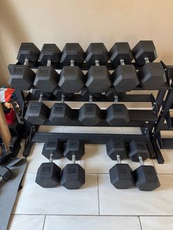 Dumbbells rubber hex weights 0.90$ a pound plus rack 1,190lbs total 70-100lbs