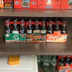 Unopened Coke bottles. 1994, 1996.
