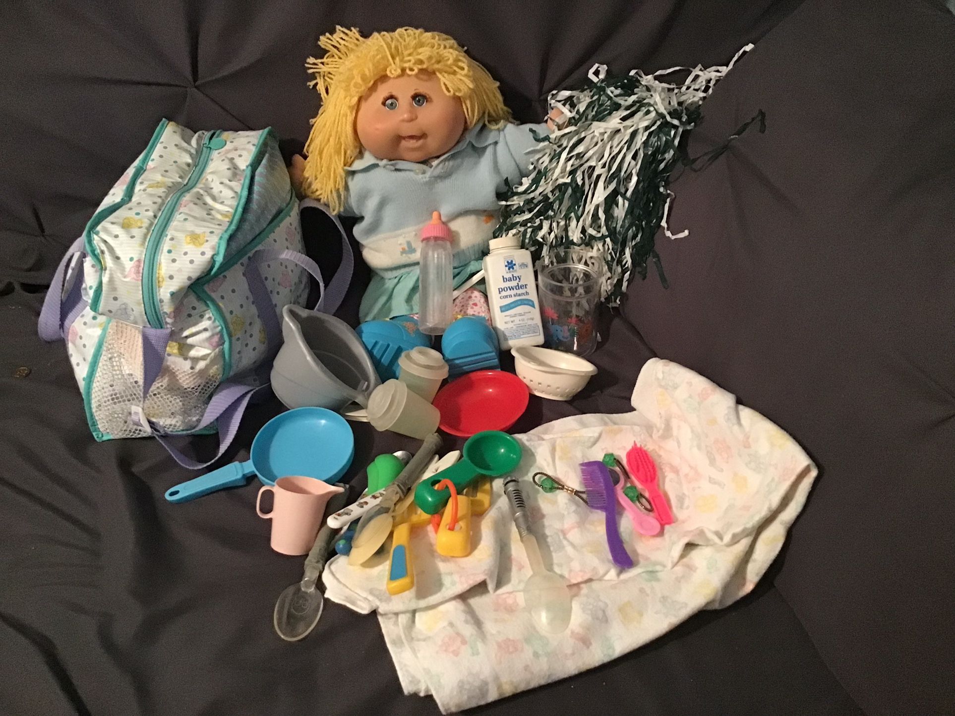 Cabbage Patch Doll Comes With Blanket, Dishes, Diaper Bag, Pom Pom, Bottle As Shown