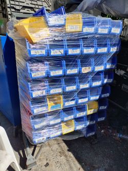 Storage organizing bins. Around 80 of them in each rack. $140 each rack. They need miner cleaning. They have sticker labels.