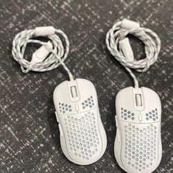 Two white D-110 gaming mice
