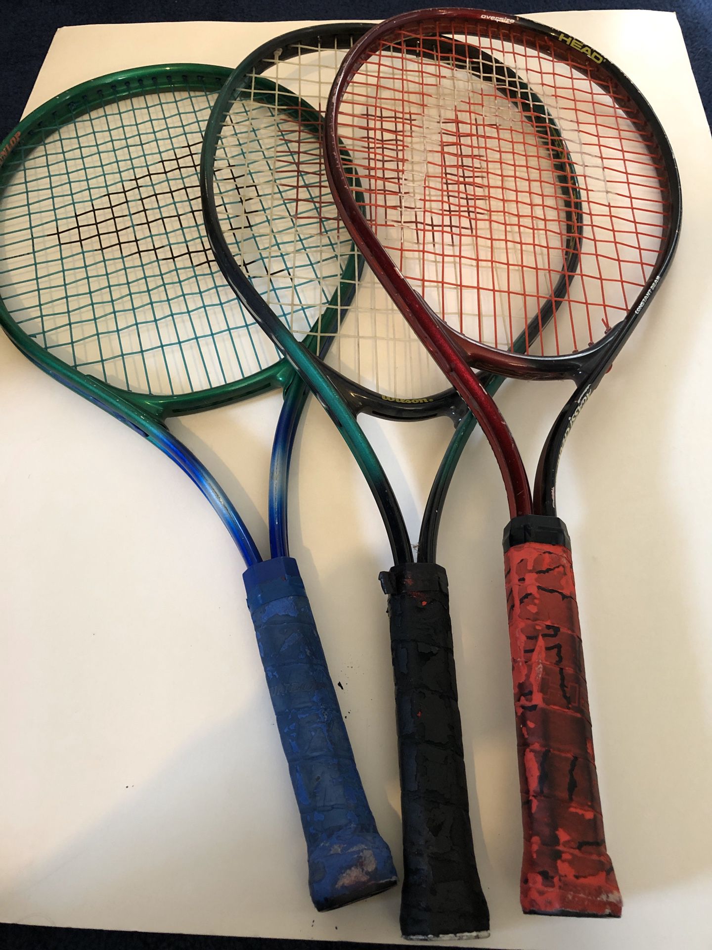One tennis racket left. Black handle one.