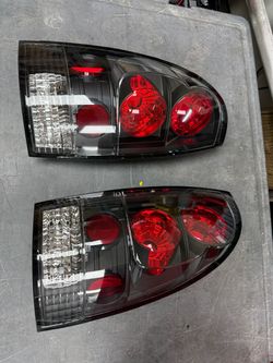 Spyder 5007896 Euro Tail Lights Black Clear 2005-2015 Toyota Tacoma Pair