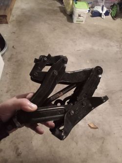 Car jack and lug nut bar