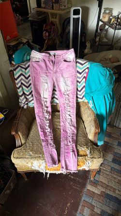 Pink ripped up skinny jeans