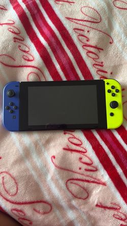 Nintendo Switch with Blue and Yellow Joy-Cons
